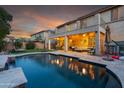 Inviting pool and patio area with seating and lighting at 5116 W Trotter Trl, Phoenix, AZ 85083