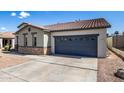 Front view of the house showcasing a grey garage door at 19741 E Reins Rd, Queen Creek, AZ 85142