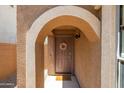 Inviting entryway with arched entry and terracotta tile floor at 17555 W Dalea Dr, Goodyear, AZ 85338