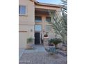 Two-story house entrance with decorative stone and landscaping at 44973 W Sandhill Rd, Maricopa, AZ 85139