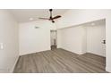 Spacious living area featuring hardwood floors and ceiling fan at 916 S Melody Ln, Tempe, AZ 85281