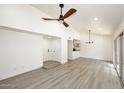 Open concept dining area with sliding glass doors and chandelier at 916 S Melody Ln, Tempe, AZ 85281
