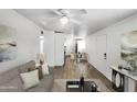 Bright and airy living room with open layout and wood-look floors at 2236 E Nancy Ln, Phoenix, AZ 85042