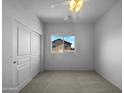 Bright bedroom with double door closet and carpet at 944 E Runaway Bay Pl, Chandler, AZ 85249