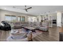 Spacious living room with comfortable seating and large windows at 32269 N 133Rd Dr, Peoria, AZ 85383