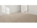 Spacious bedroom with neutral carpeting and lots of natural light at 37375 W Patterson St, Maricopa, AZ 85138