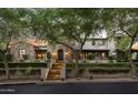 Tuscan-style home with stone exterior and landscaping at 19452 N 98Th Pl, Scottsdale, AZ 85255