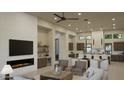 Open floor plan great room with fireplace and kitchen at 26924 N 35Th Ln, Phoenix, AZ 85083