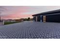 Modern home with a large, paved driveway and two-car garage at 12 E Quartz Rock Rd, Phoenix, AZ 85085