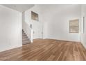 Bright living room with hardwood floors and high ceilings at 43260 W Alexandra Ct, Maricopa, AZ 85138