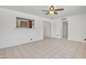 Living room with tile floors and a ceiling fan at 3315 E Hubbell St, Phoenix, AZ 85008