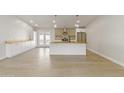 Open concept kitchen with island and stainless steel appliances at 6802 E Beverly Ln, Scottsdale, AZ 85254