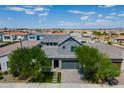 Modern two-story house with gray exterior, gray roof and a 2 car garage at 4226 E Coconino Pl, Chandler, AZ 85249