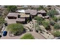 Luxury estate home with a circular driveway, a large pool, and a stunning desert landscape at 8157 E Sierra Morena St, Mesa, AZ 85207