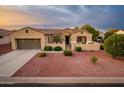 One-story house with two car garage and desert landscaping at 12840 W Santa Ynez Dr, Sun City West, AZ 85375