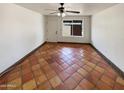 Bright living room with terracotta tile floors and lots of natural light at 17839 N 43Rd St, Phoenix, AZ 85032