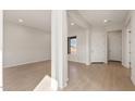 Bright and airy entryway with hardwood flooring and lots of natural light at 26042 S 224Th Pl, Queen Creek, AZ 85142