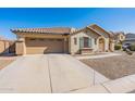 One-story home with green shutters and gravel landscaping at 40350 W Art Pl, Maricopa, AZ 85138