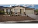 Beautiful ranch-style home with landscaping and two-car garage at 3035 W Thurman Dr, Laveen, AZ 85339