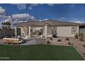 Large backyard with patio, seating area, and grass at 3035 W Thurman Dr, Laveen, AZ 85339