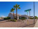 House exterior view, showing landscaping and street signage at 15107 W Las Brizas Ln, Sun City West, AZ 85375