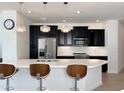 Modern kitchen with dark cabinets, white countertops, and island at 2511 W Queen Creek Rd # 417, Chandler, AZ 85248