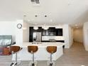 Modern kitchen with dark cabinets, white countertops, and island at 2511 W Queen Creek Rd # 417, Chandler, AZ 85248