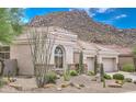 Beautiful desert home exterior with landscaping and mountain backdrop at 11377 E Diamond Cholla Dr, Scottsdale, AZ 85255