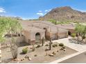 Single-story home with desert landscaping and mountain views at 11377 E Diamond Cholla Dr, Scottsdale, AZ 85255