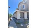 Modern townhome community with covered porches and walkways at 639 W Pepper Pl # 102, Mesa, AZ 85201