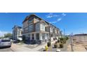 Townhouses with covered porches and street views at 639 W Pepper Pl # 107, Mesa, AZ 85201