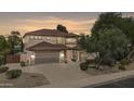 Two-story home with brown tile roof and attached garage at 6574 S Crestview Dr, Gilbert, AZ 85298