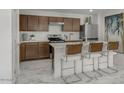 Modern kitchen with stainless steel appliances and an island at 5749 S 243Rd Dr, Buckeye, AZ 85326