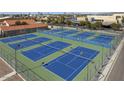 View of multiple well-maintained tennis courts at 5753 S 243Rd Dr, Buckeye, AZ 85326