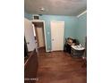 Simple bedroom with wood flooring and light walls at 6321 N 65Th Dr, Glendale, AZ 85301