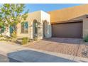 Single-story home with desert landscaping, two-car garage, and light-colored stucco at 729 E Cobble Stone Dr, San Tan Valley, AZ 85140