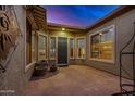 Inviting courtyard entry with flagstone flooring and potted plants at 26747 N 127Th Dr, Peoria, AZ 85383