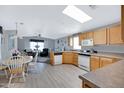 Open concept kitchen with island, dining area and living room view at 201 S Greenfield Rd # 11, Mesa, AZ 85206