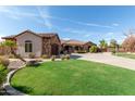 Two-story home exterior with a large yard and driveway at 6918 E Granada St, Mesa, AZ 85207