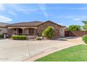 Front view of a single-story house with stone and tile finishes at 6918 E Granada St, Mesa, AZ 85207
