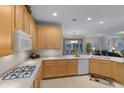 Well-equipped kitchen featuring stainless steel appliances and ample cabinetry at 42818 W Morning Dove Ln, Maricopa, AZ 85138