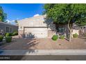 House exterior with a two-car garage and landscaping at 6202 E Mckellips Rd # 310, Mesa, AZ 85215