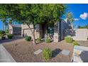 House exterior showcasing a two-car garage and landscaping at 6202 E Mckellips Rd # 310, Mesa, AZ 85215