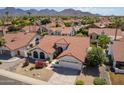 Single story home with red tile roof and landscaped yard at 13355 N 100Th Pl, Scottsdale, AZ 85260