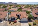 Single story home with red tile roof and landscaped yard at 13355 N 100Th Pl, Scottsdale, AZ 85260