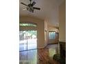 Living room features hardwood floors and a view of the backyard at 15151 N 100Th Way, Scottsdale, AZ 85260