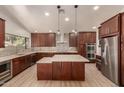 Spacious kitchen featuring modern cabinetry, stainless steel appliances, and a large island at 6325 E Monte Cristo Ave, Scottsdale, AZ 85254