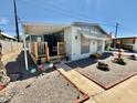 Single-wide manufactured home with wood deck at 305 S Val Vista Dr # 37, Mesa, AZ 85204