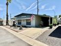 Single-wide manufactured home with small yard at 305 S Val Vista Dr # 37, Mesa, AZ 85204