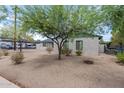 Brick house with green trim and desert landscaping at 1818 W Thomas Rd, Phoenix, AZ 85015